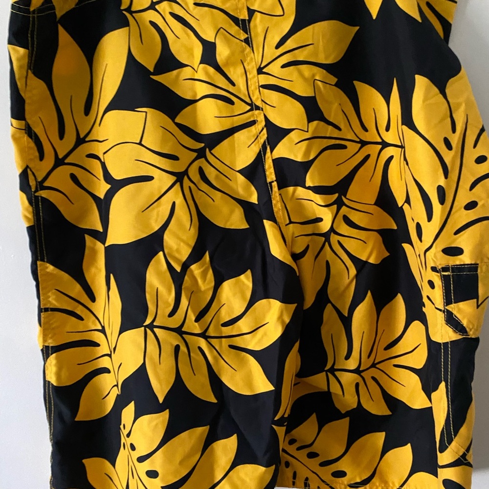 Black and yellow flowers board shorts size XL